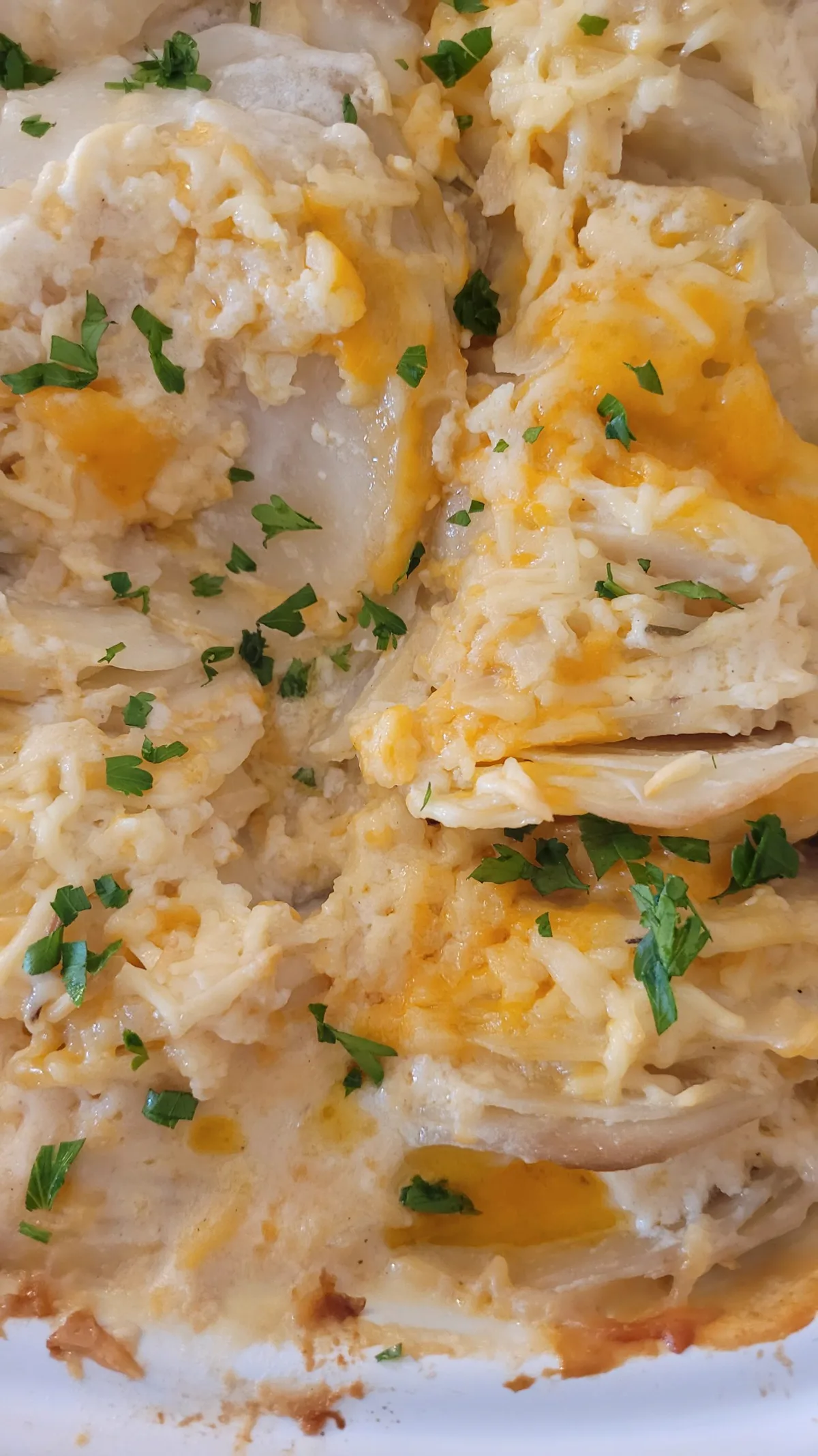 Baked potatoes topped with a rich melted cheddar cheese sauce
