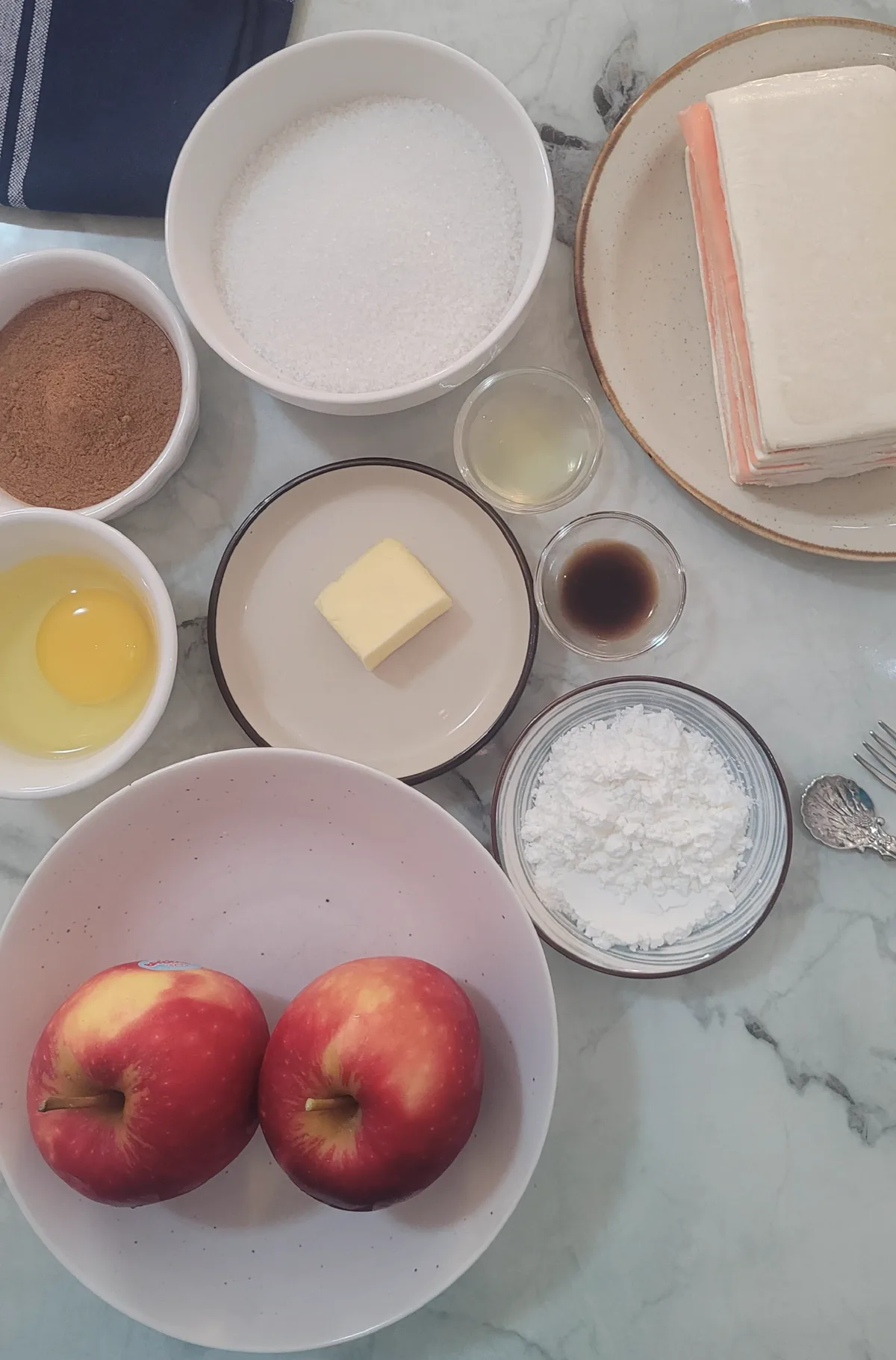 Apple filling and pastry being prepared for baking