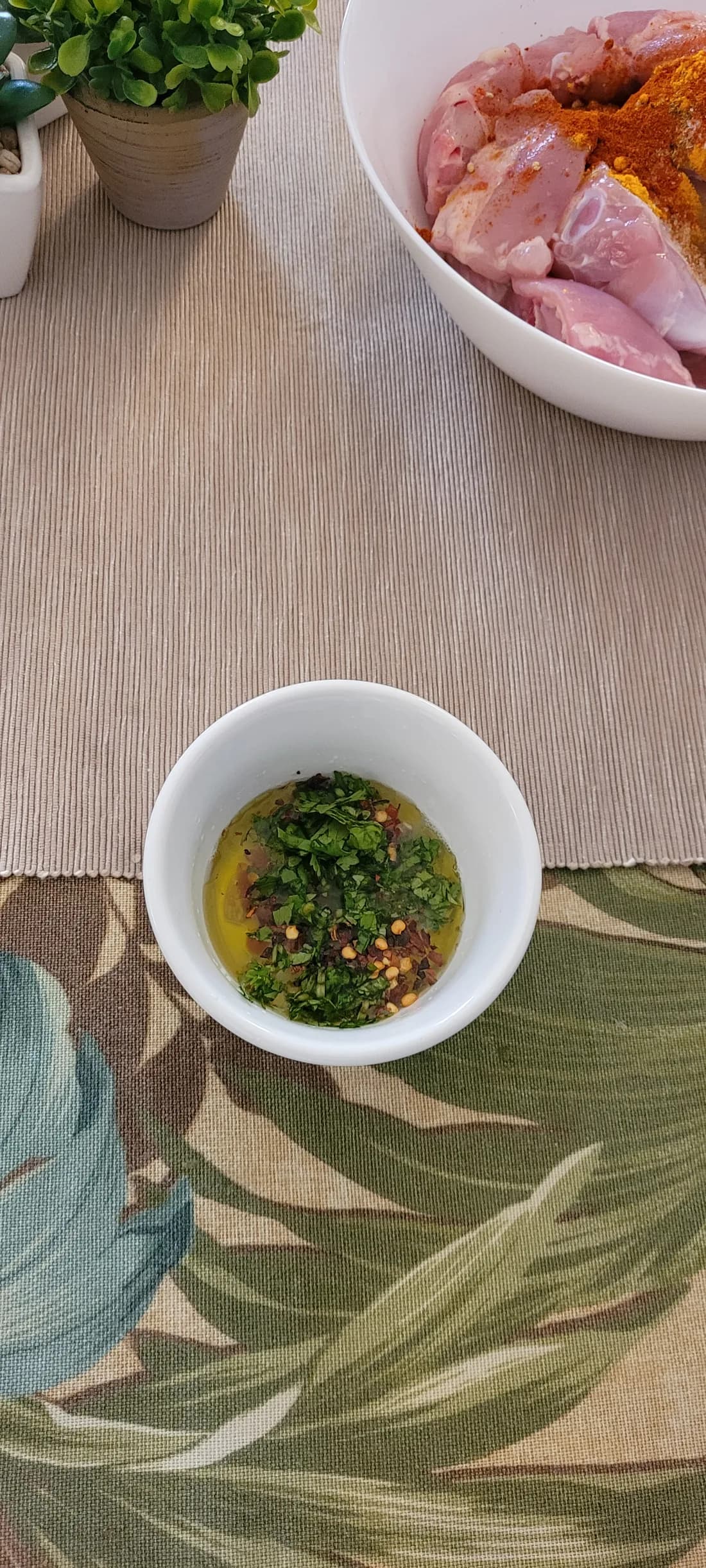 Oil, herbs, and chili flakes ready to season the chicken