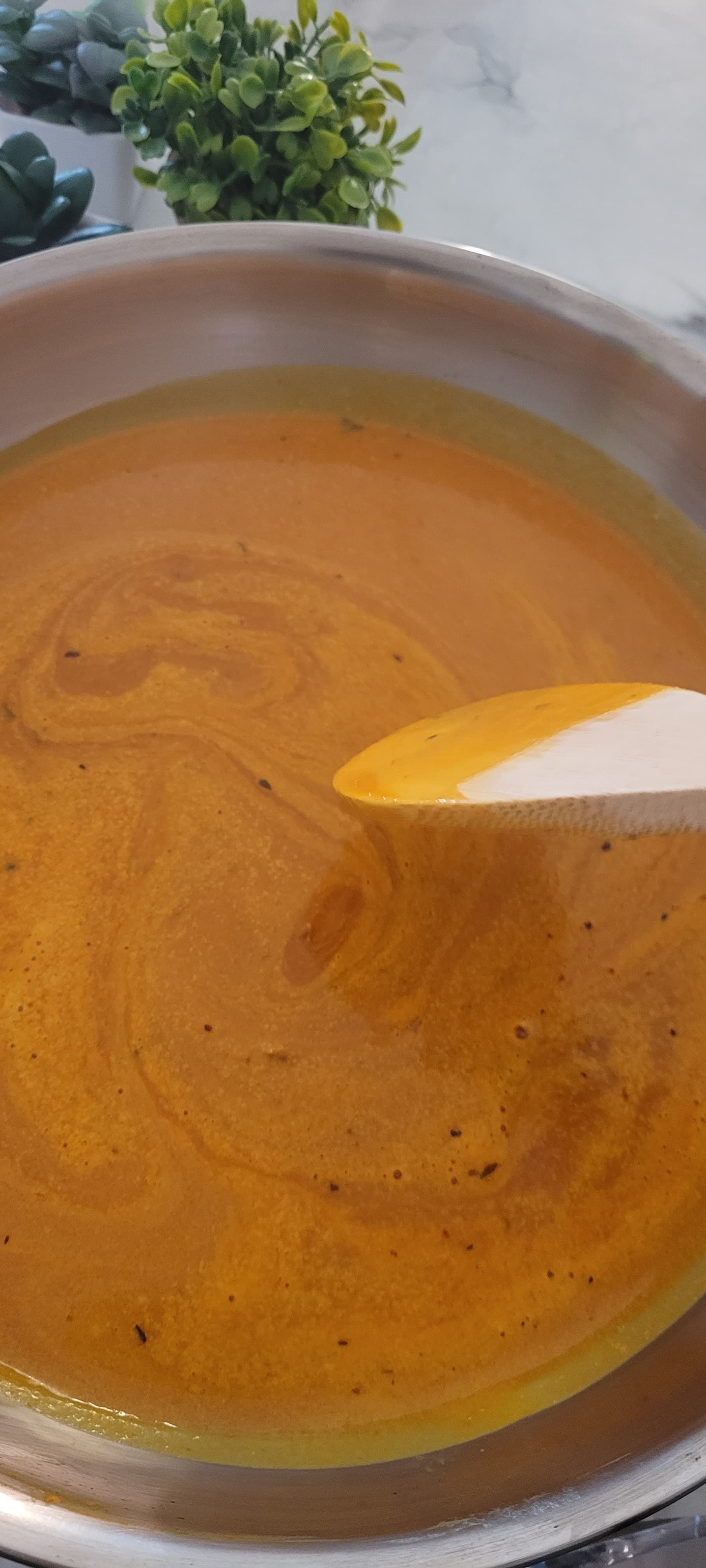 Pasta ingredients being combined in a pot