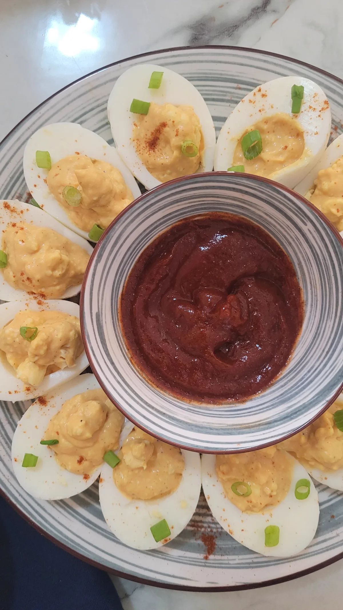 Creamy stuffed egg halves finished with paprika and herbs
