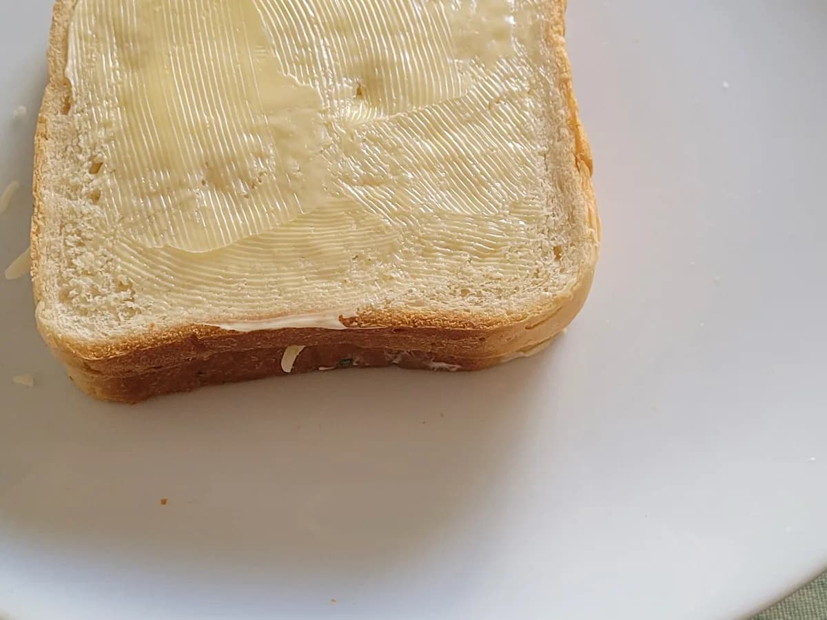 Butter spread on the outside of sandwich bread before grilling